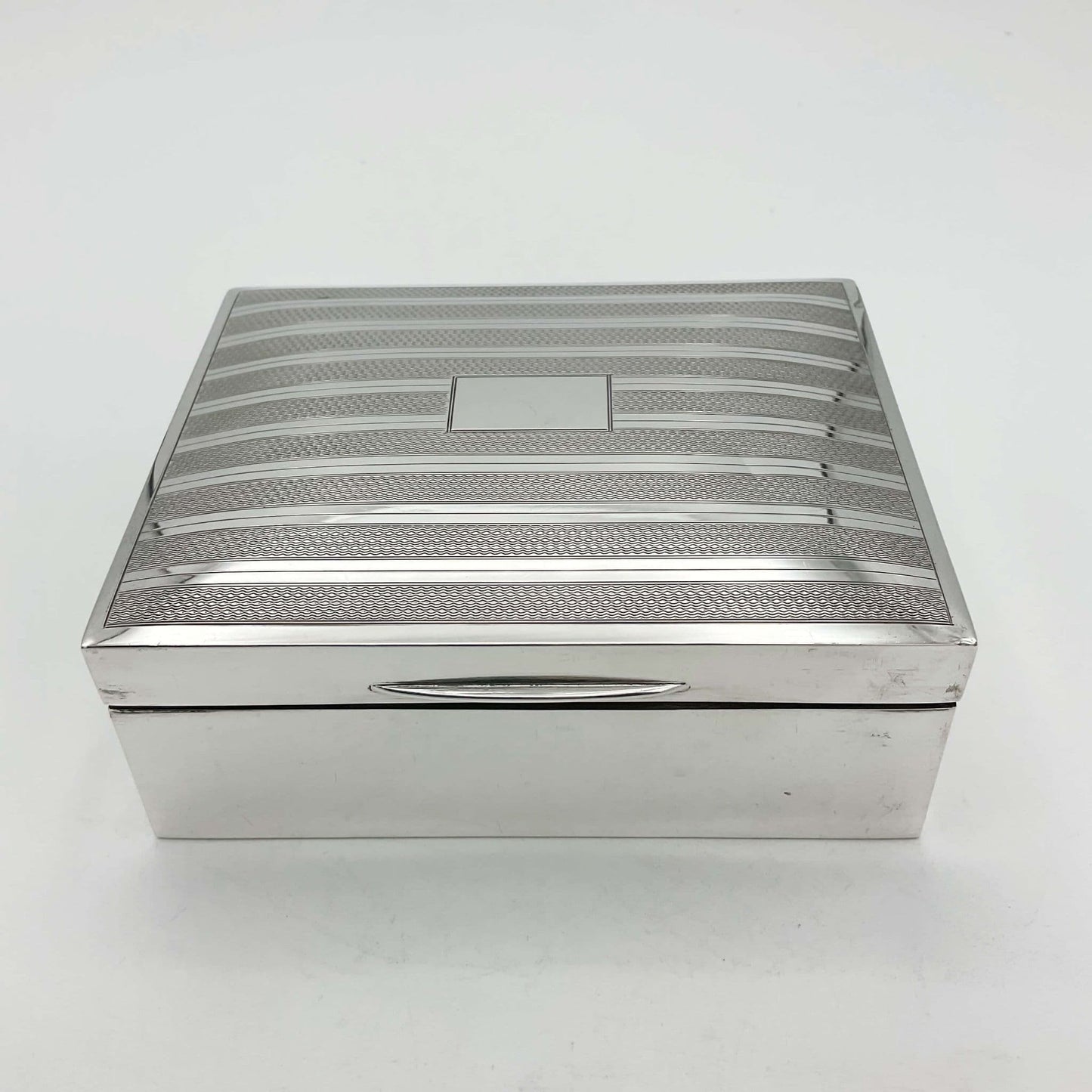 vintage 1920s sterling silver cigarette box on a whiter background