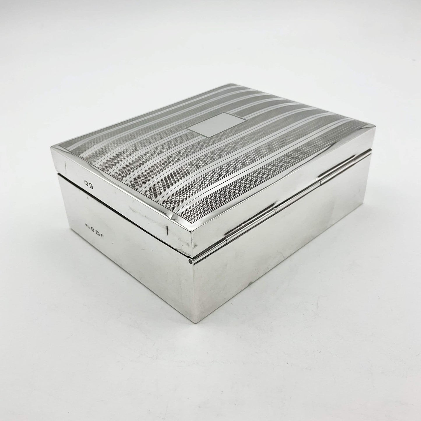 back view showing the hinge of the vintage silver cigarette box