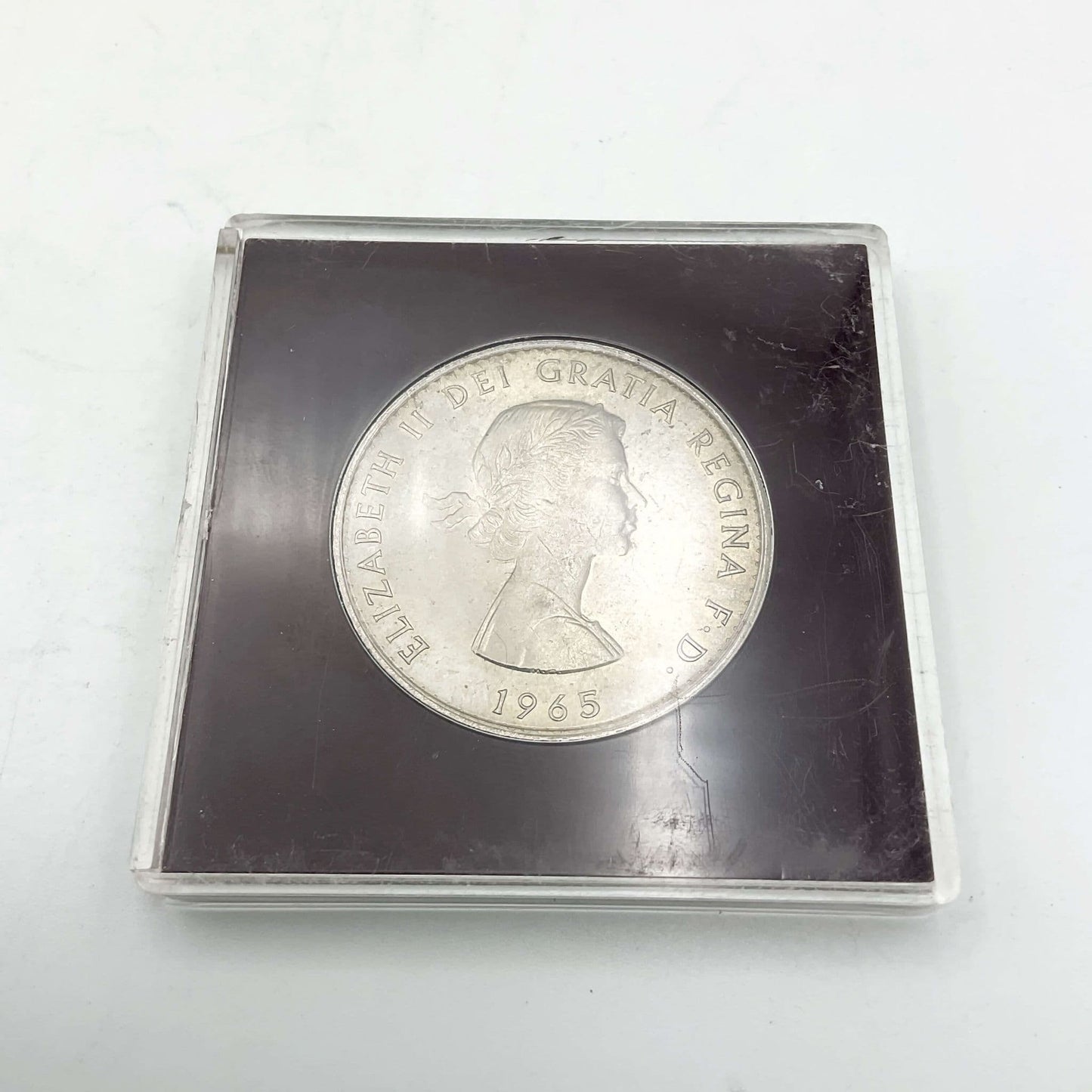 Reverse side of 1965 Winston Churchill Commemorative Crown showing the queen's head