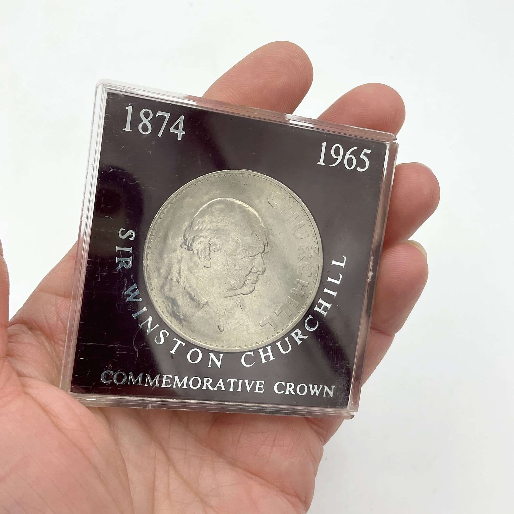 1965 Winston Churchill Commemorative Crown held in a hand