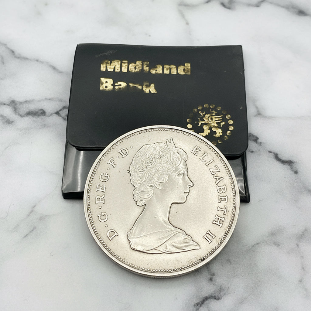 Coin on Midland Bank case on marble worktop