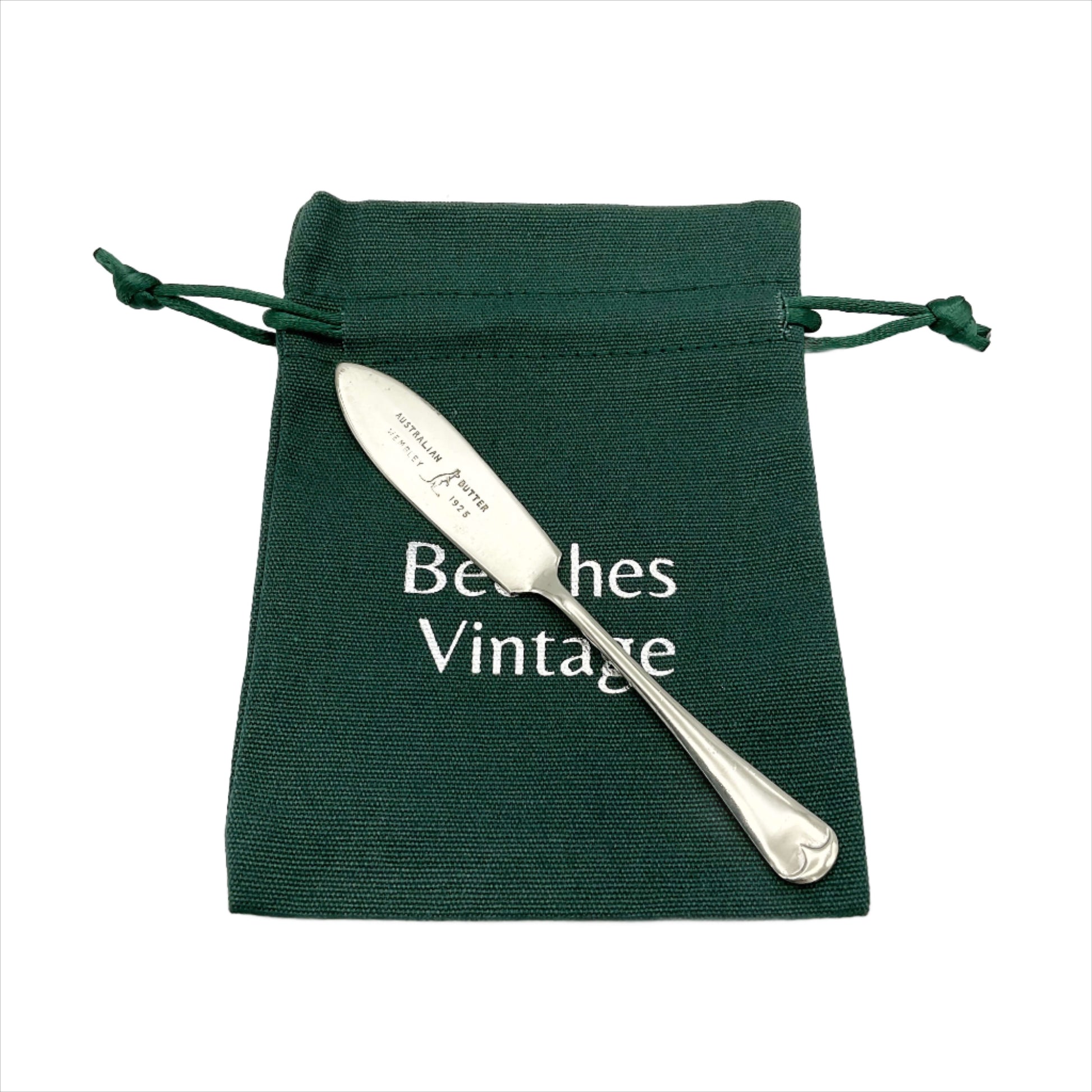 Silver plated butter knife with Australian Butter Wembley 1925 on the blade with a Kangaroo emblem on a gift bag
