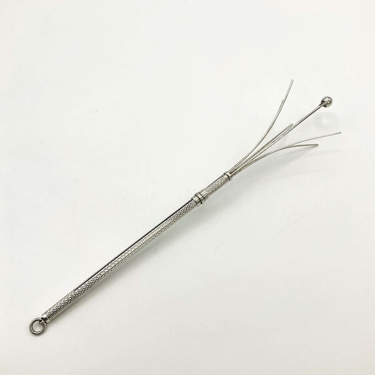 Silver whisk on a white background