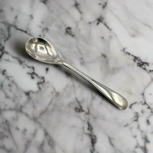 Silver spoon on a marble worktop