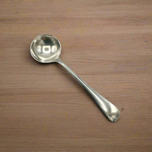 Silver spoon on a wood table