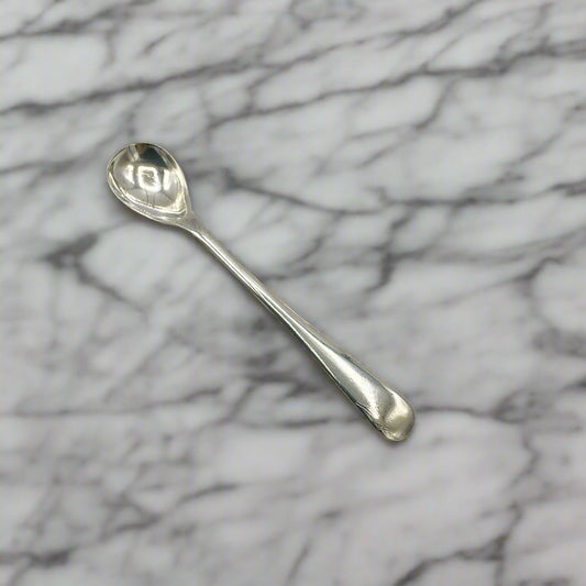 Silver spoon on a marble worktop