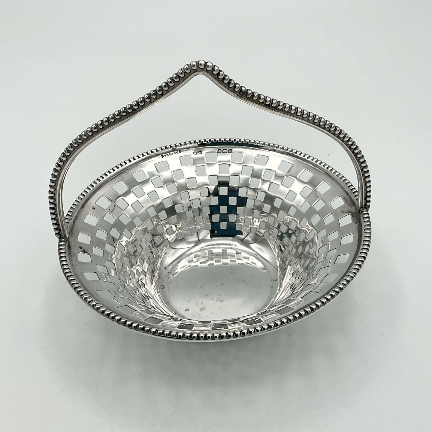 Antique Silver Basket with handle on white background