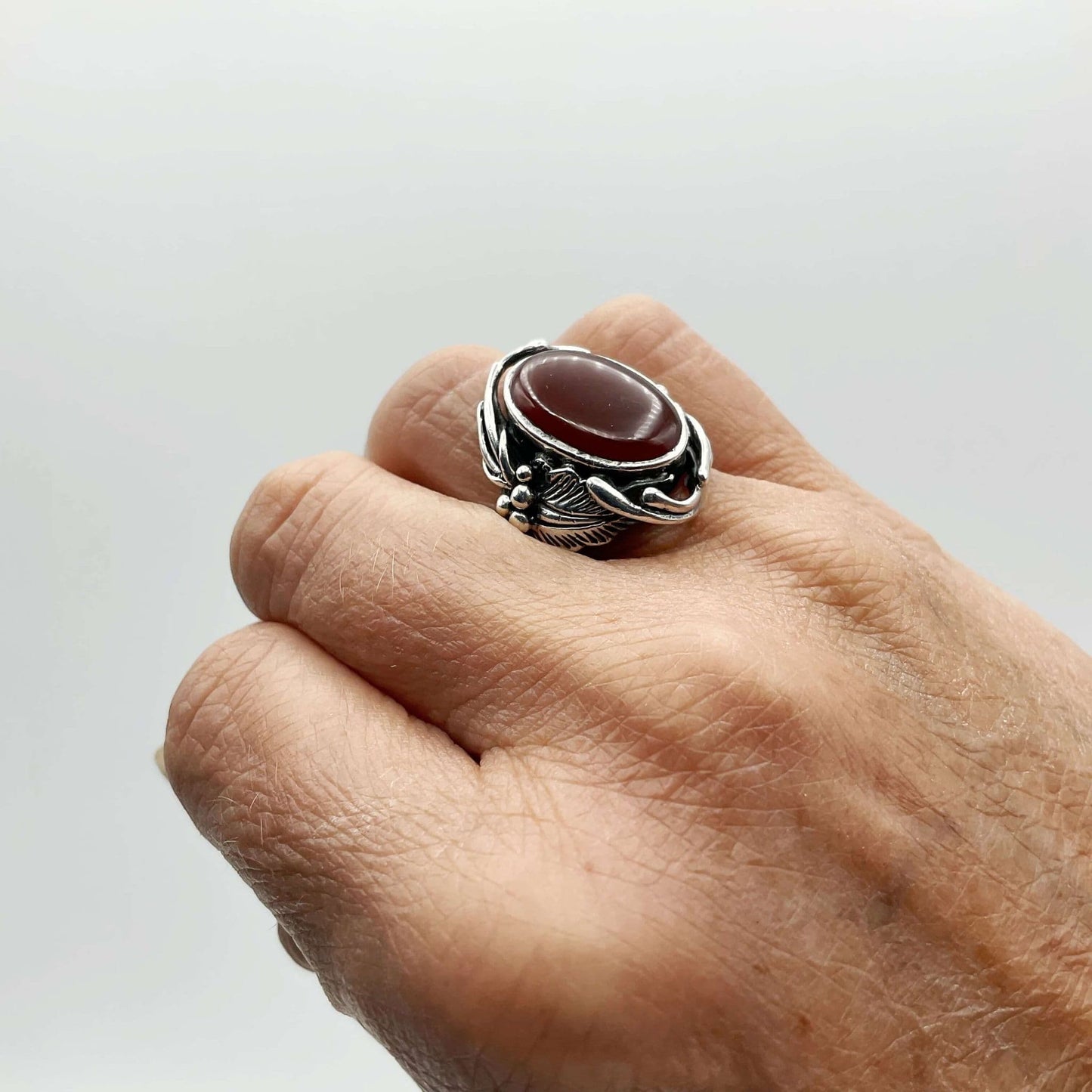 Beautiful orange Carnelian gemstone silver ring on a right ring finger
