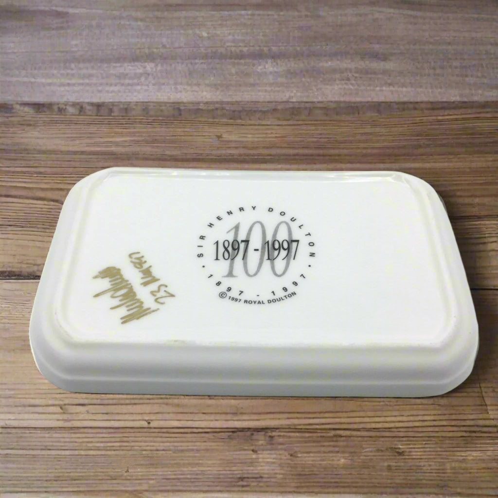 base of trinket tray upside down on wood table