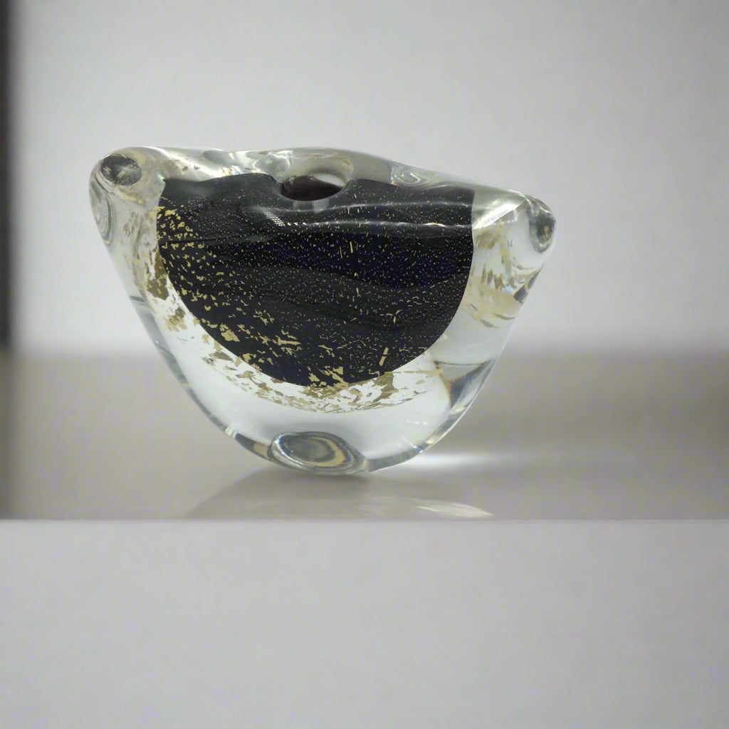 Small art glass vase on a mantelpiece