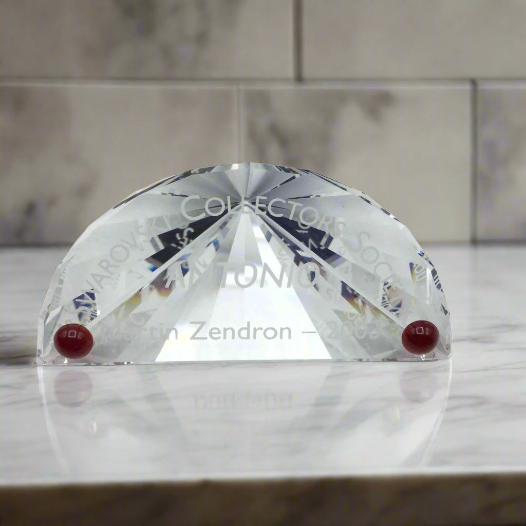 Swarovski Crystal plaque with Antonio on it on a marble worktop