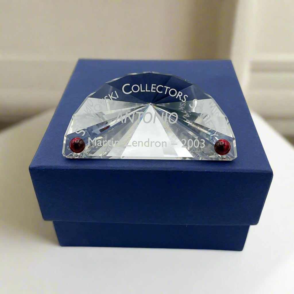 Swarovski Crystal Antonio plaque on a blue box on a table