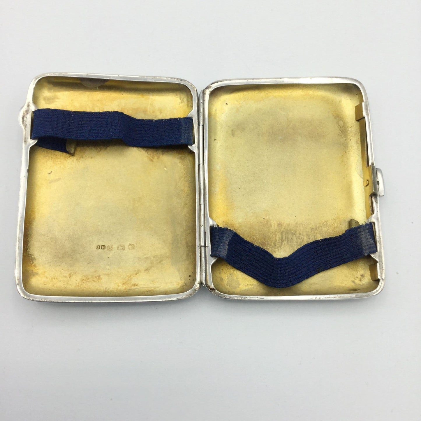 golden gilded interior of a 1930s silver cigarette case
