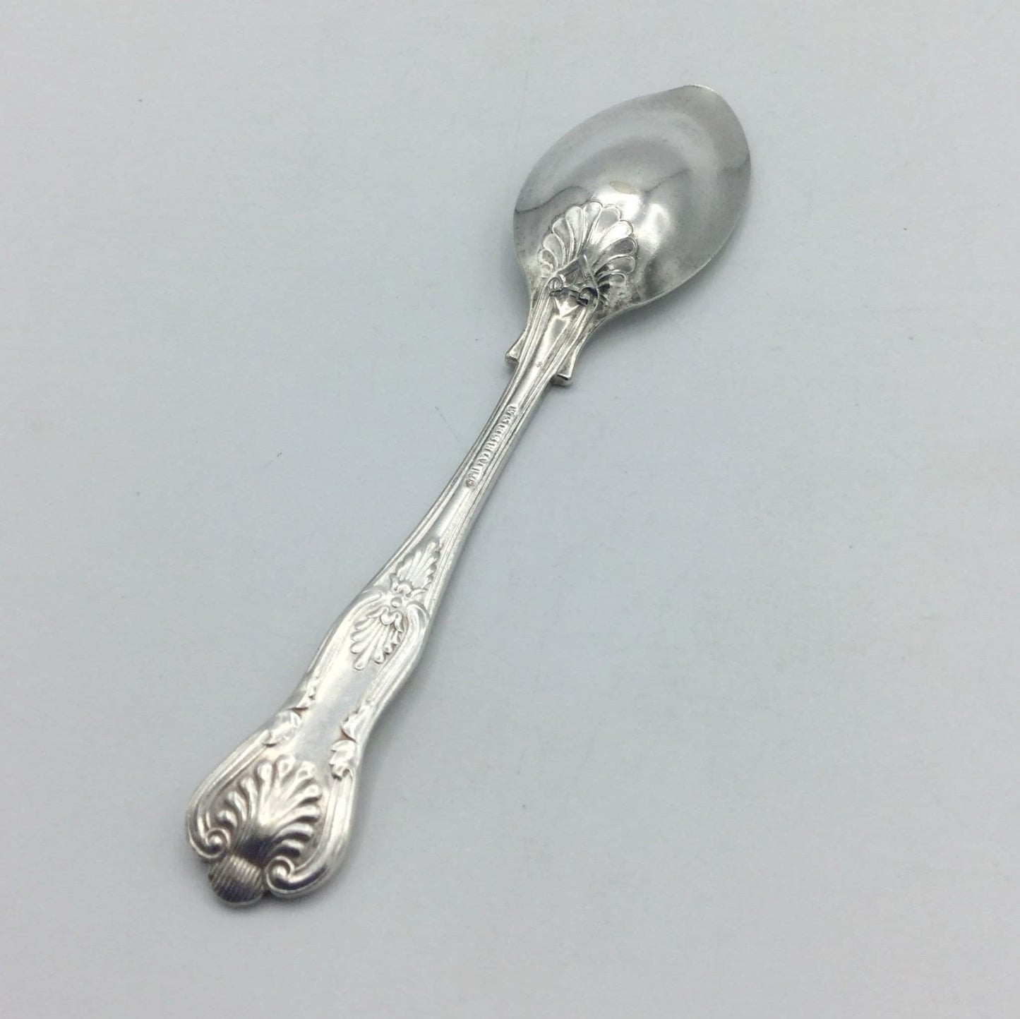 back of spoon on a grey background