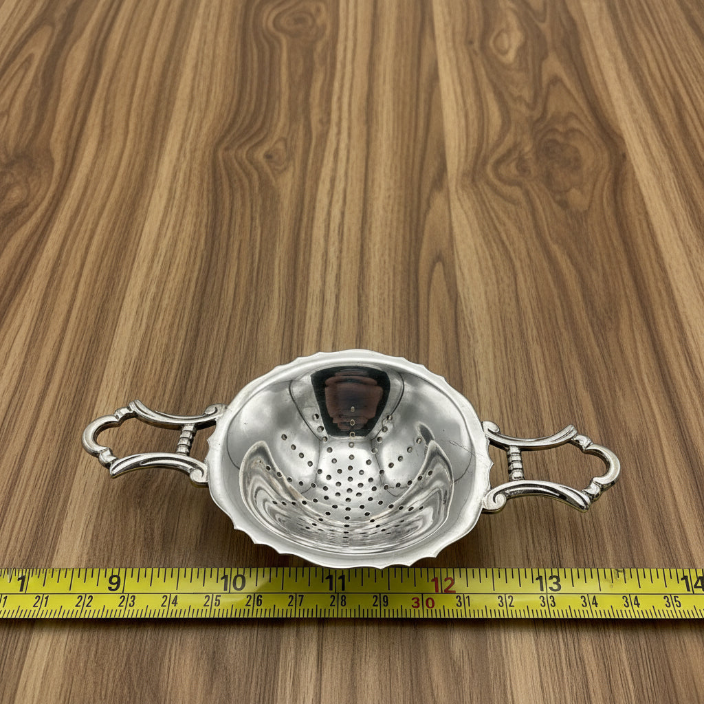 tea strainer on laminate worktop next to a tape measure for scale