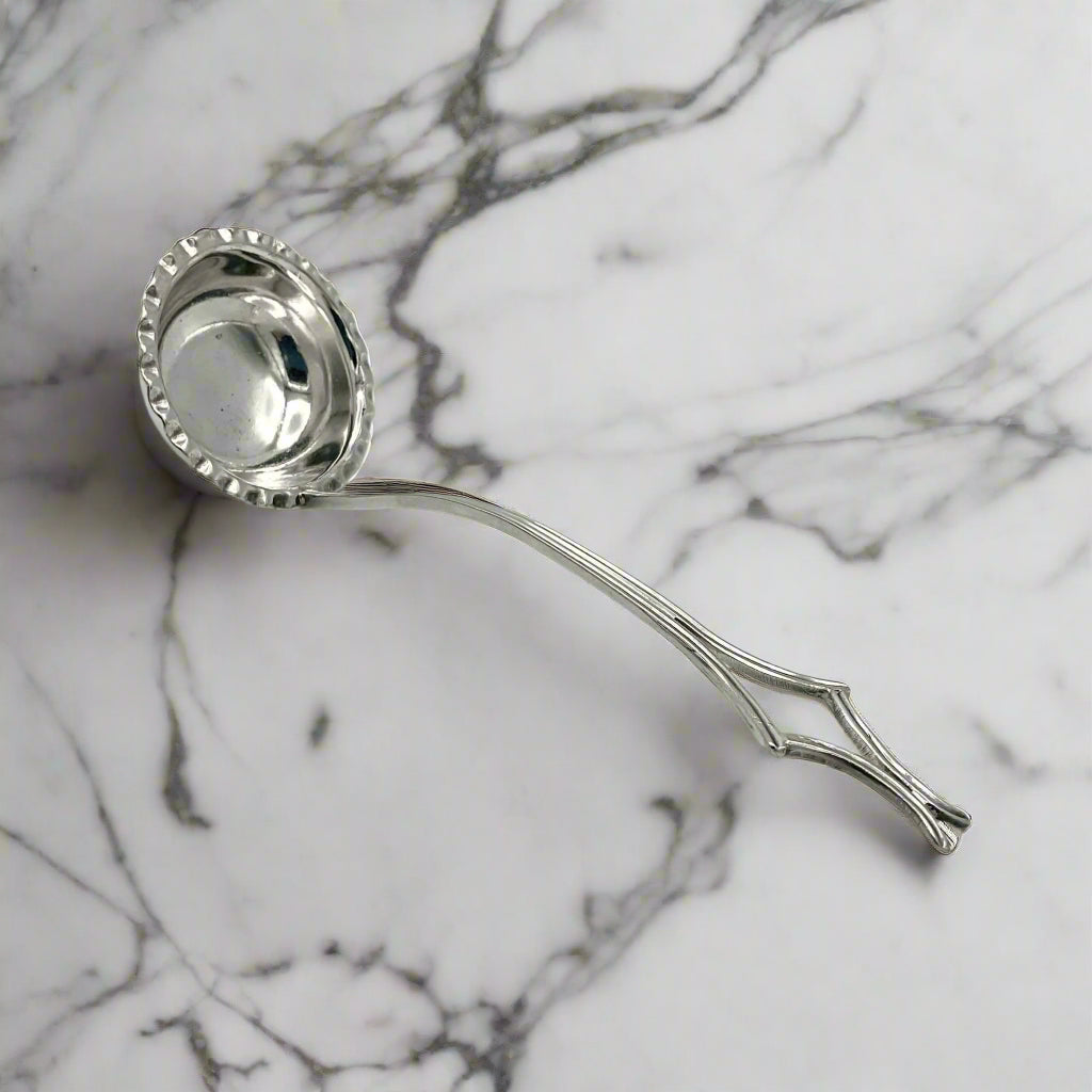 small ladle on a marble surface