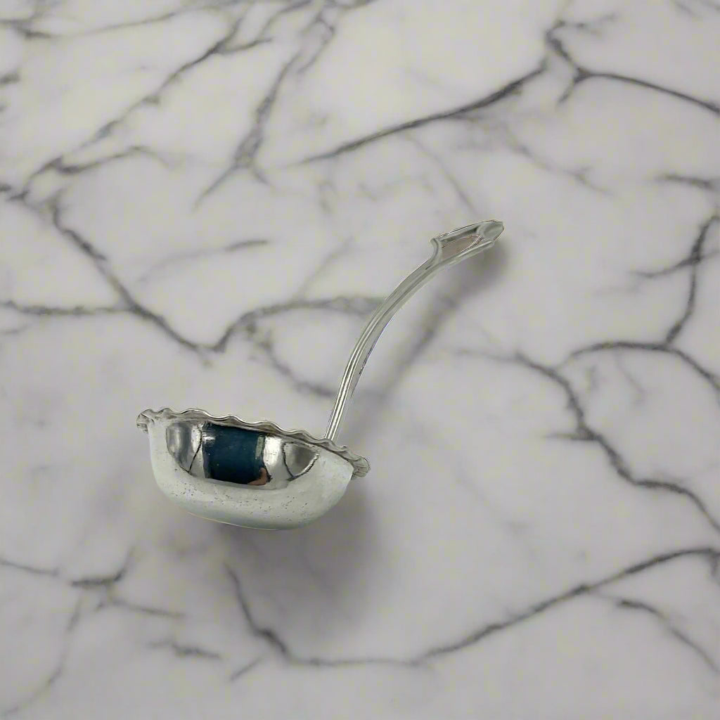 small ladle on a marble surface