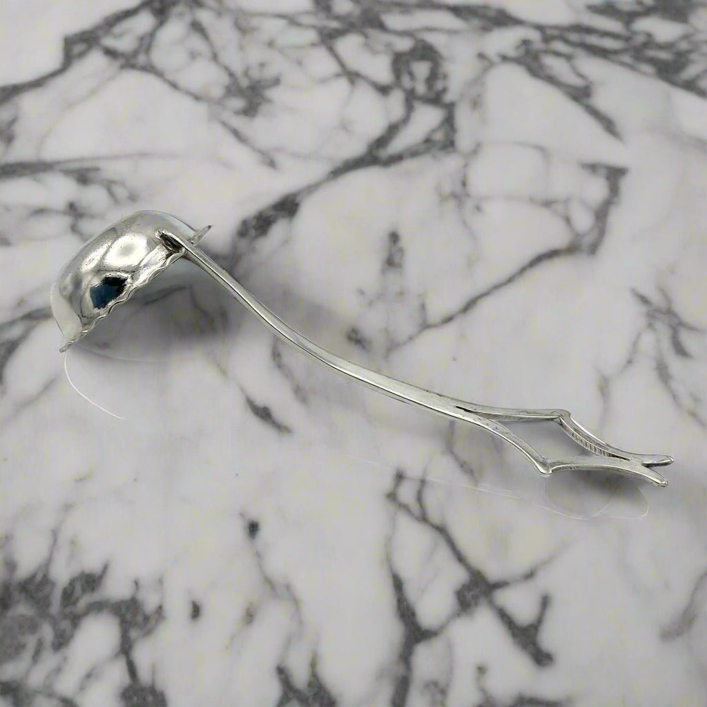 small ladle on a marble surface
