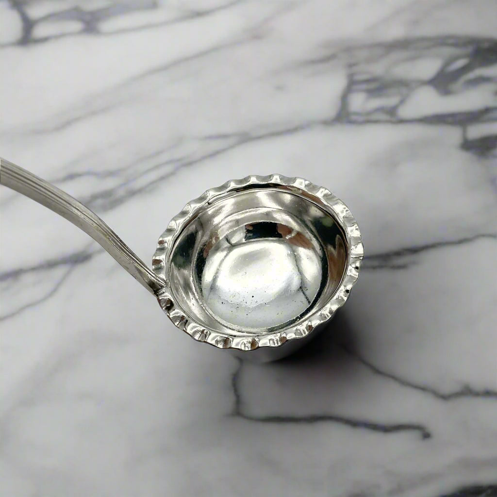 small ladle on a marble surface