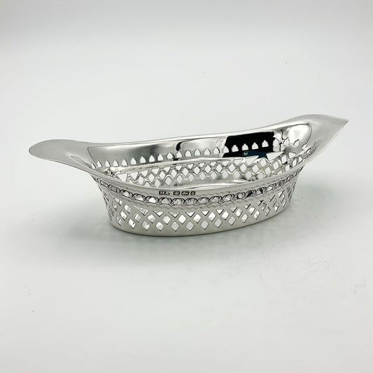 Beautiful Antique oval silver pierced bowl on white background 