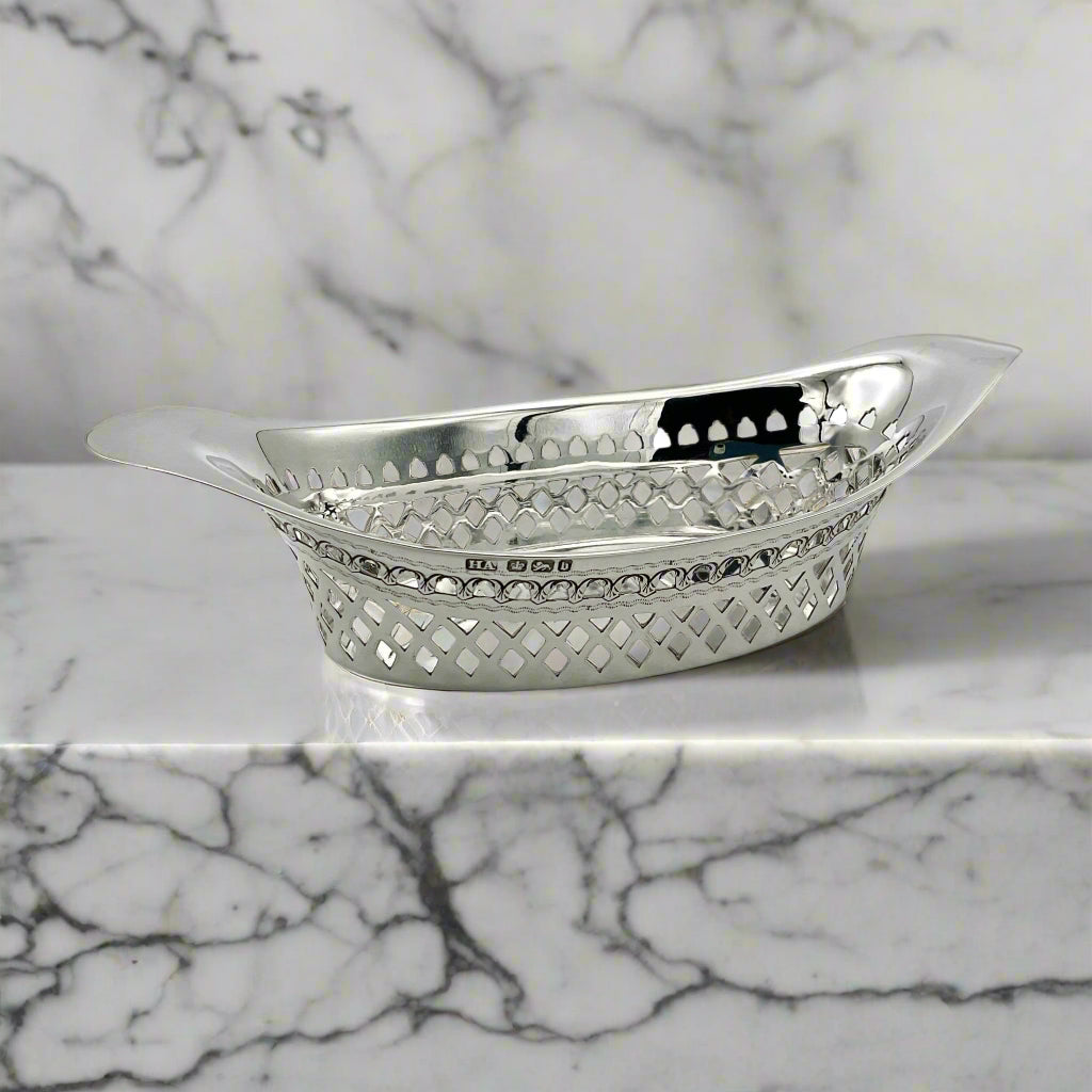 Beautiful Antique oval silver pierced bowl on a marble worktop
