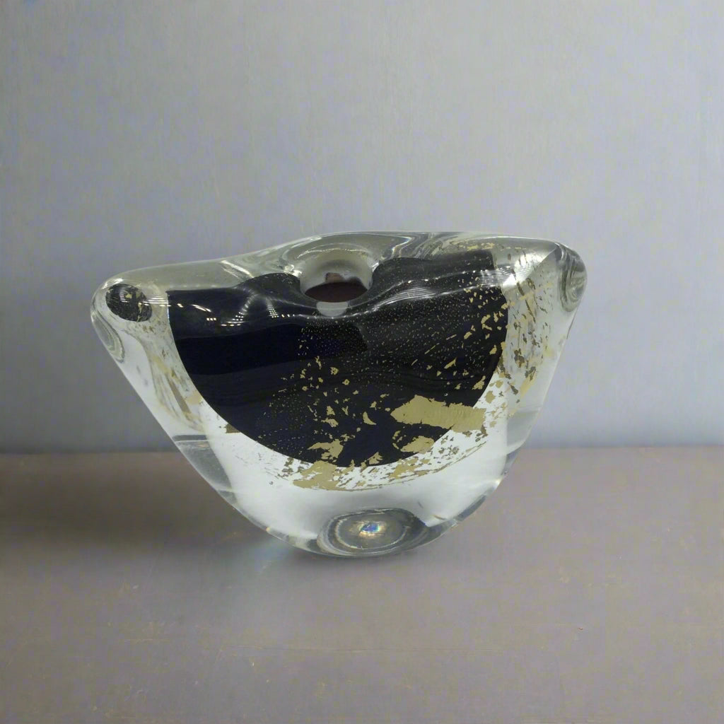Small art glass vase on a mantelpiece