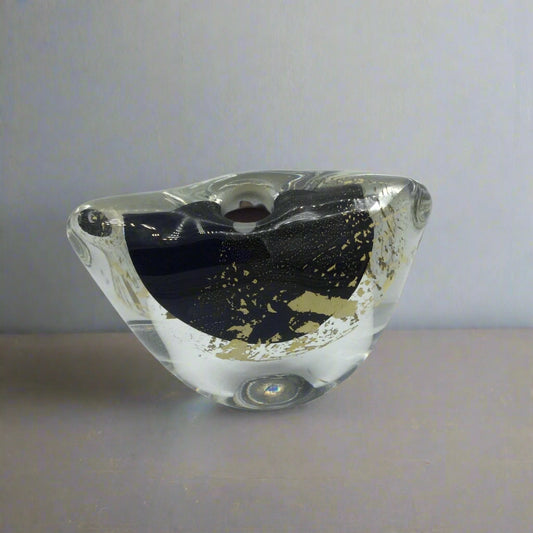 Small art glass vase on a mantelpiece
