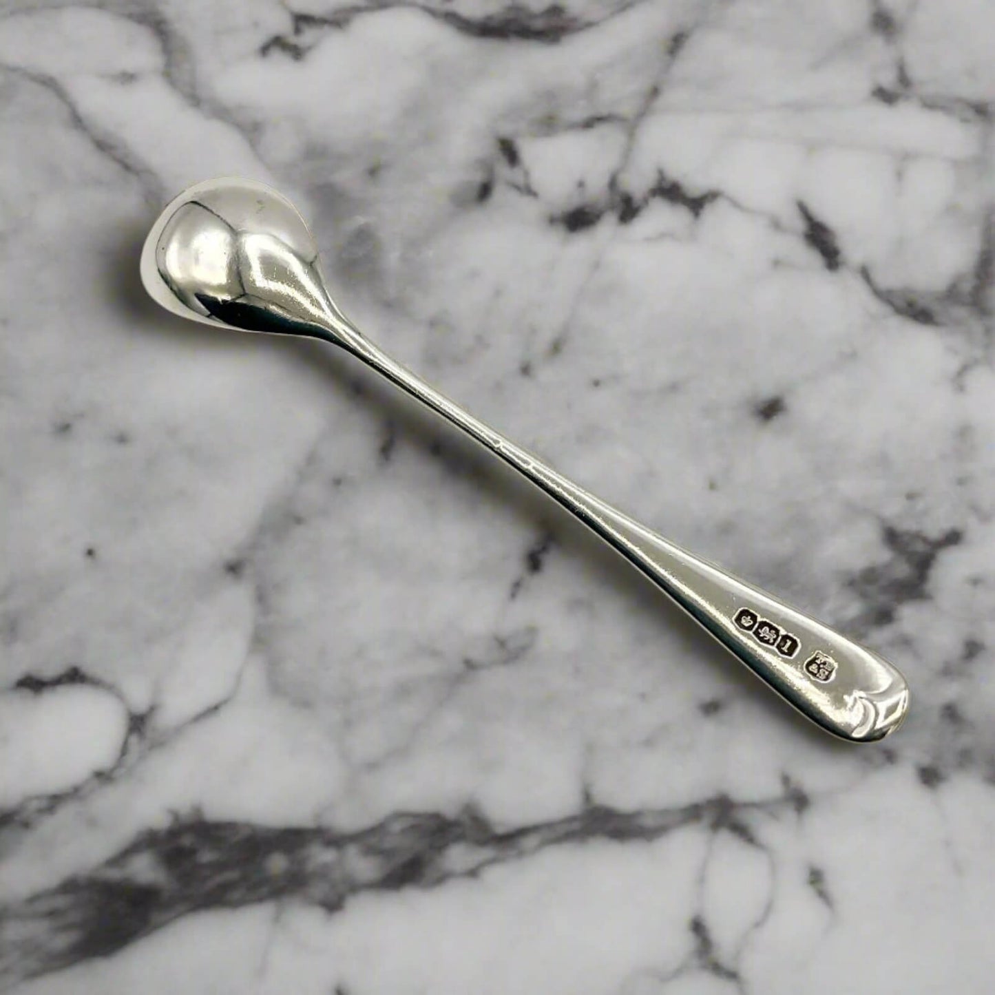 Silver spoon on a marble surface