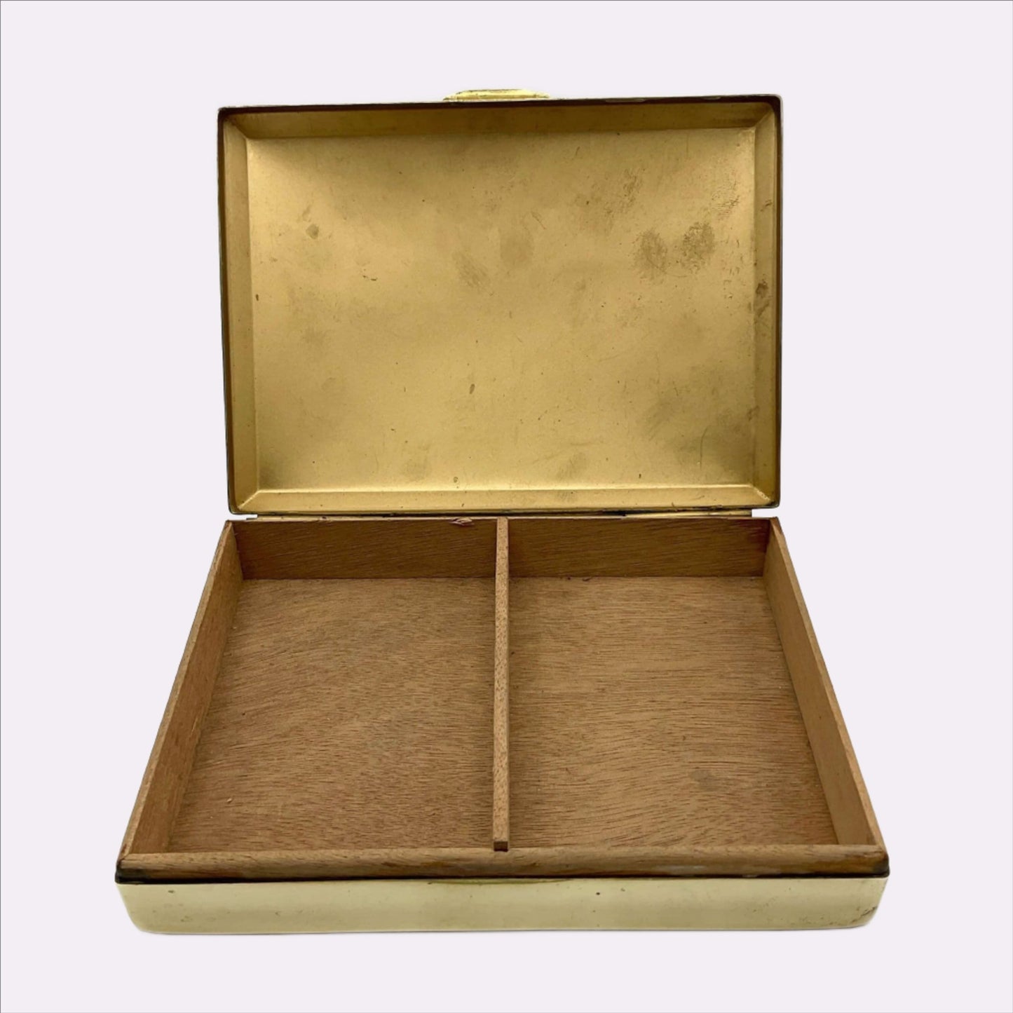 Interior of brass box showing wooden lining