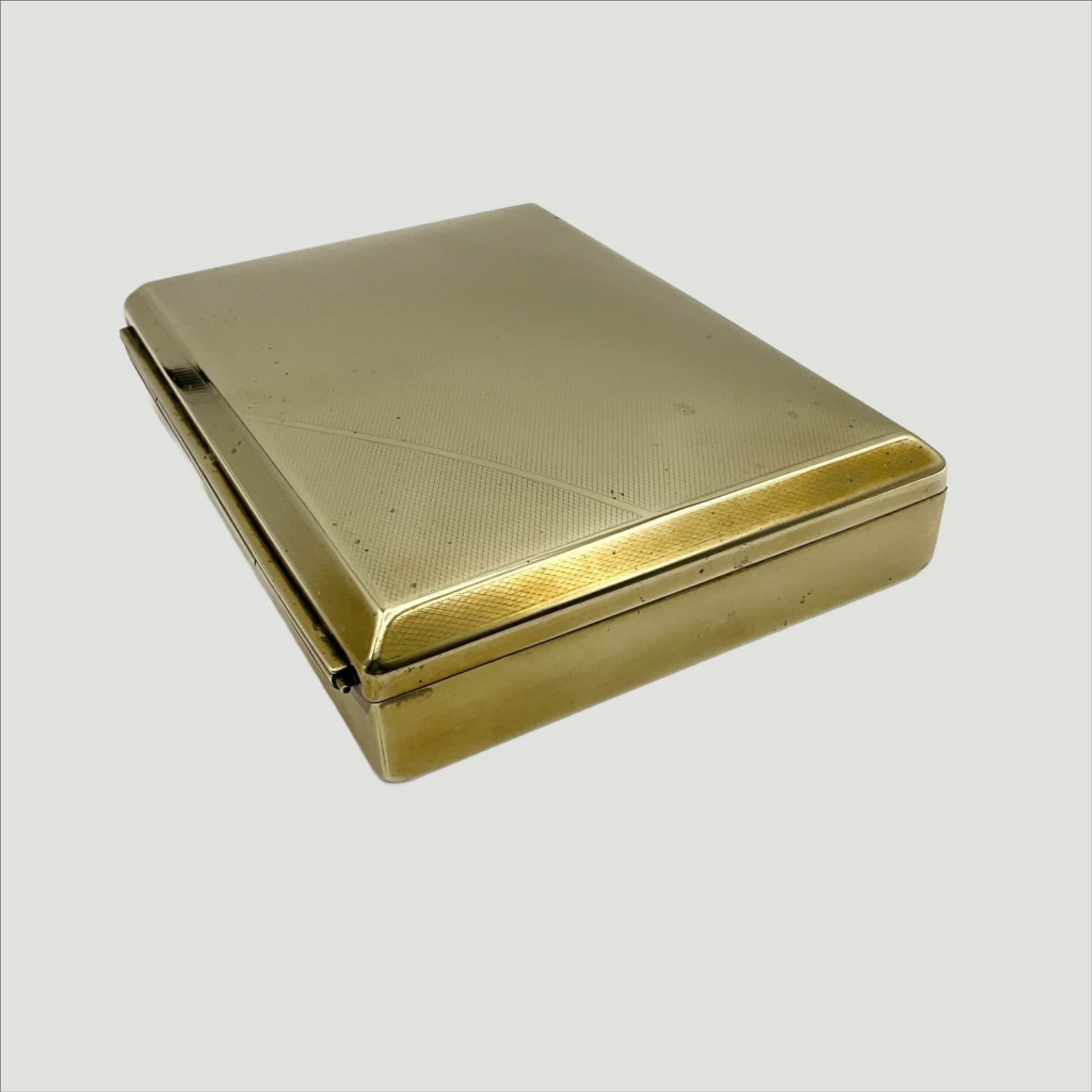Side of brass box showing back hinge
