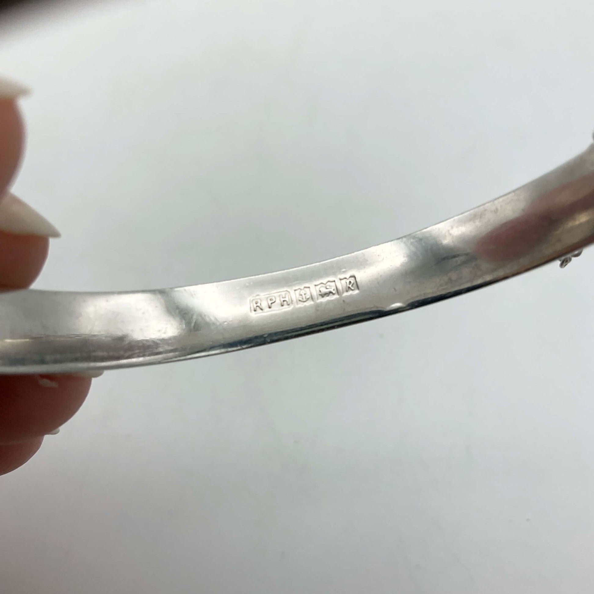 makers mark and hallmarks on the inside of the silver bracelet