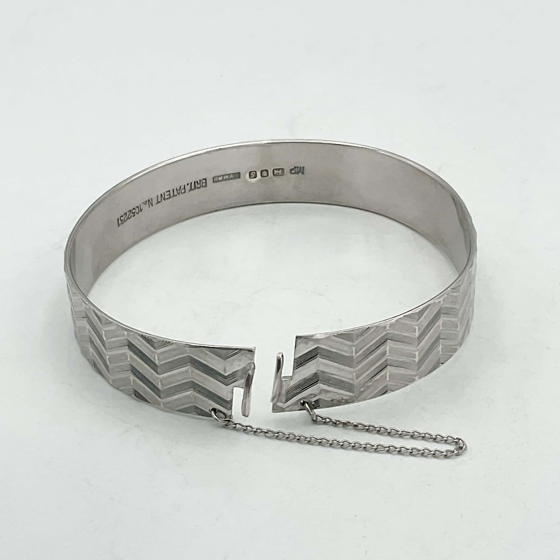 Zig zag design bracelet showing the clasp undone and safety chain
