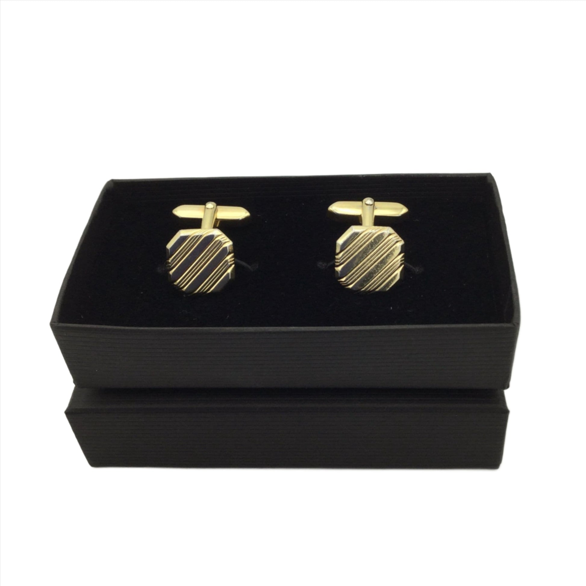 Gilded square cufflinks with a striped pattern in an open black box
