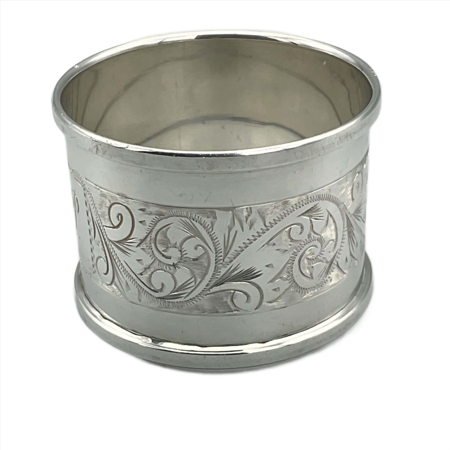 Back view of napkin ring showing a beautiful engraved leaf design on a white background