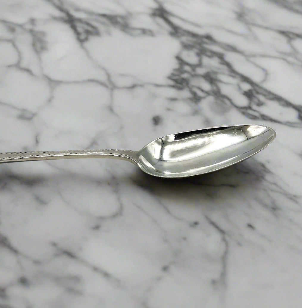 silver spoon on a marble surface