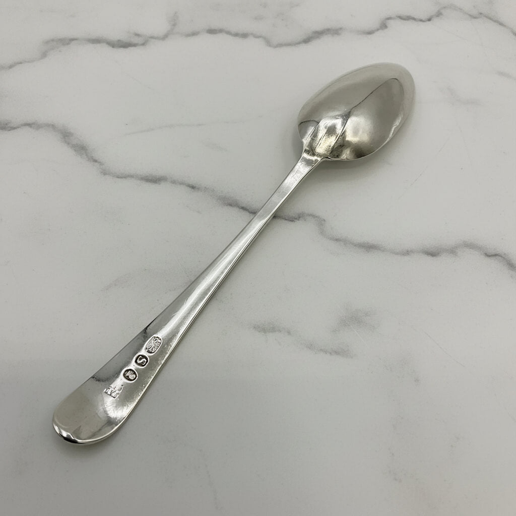 Silver spoon on a marble surface