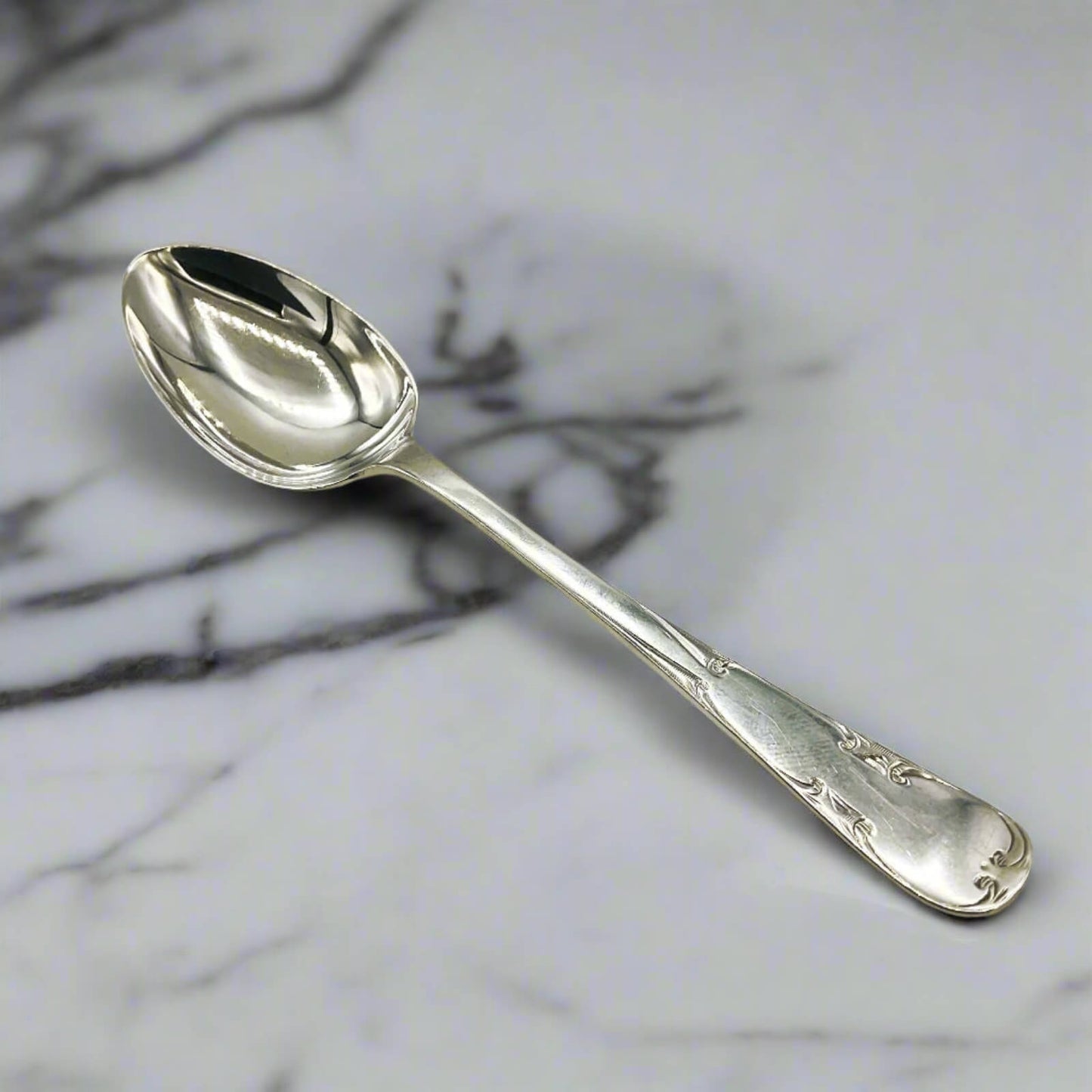 Silver spoon on a marble surface