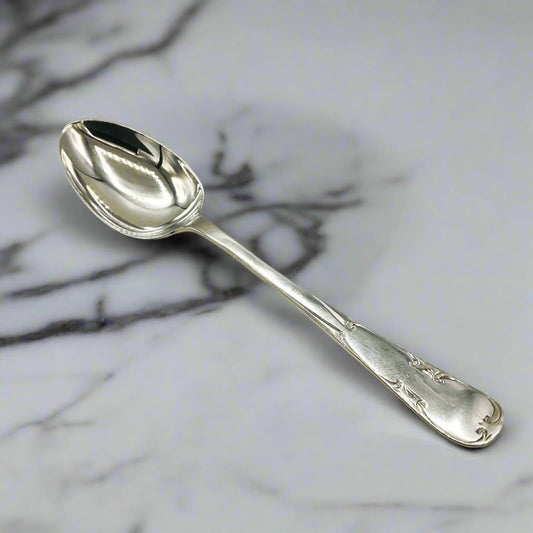 Silver spoon on a marble surface