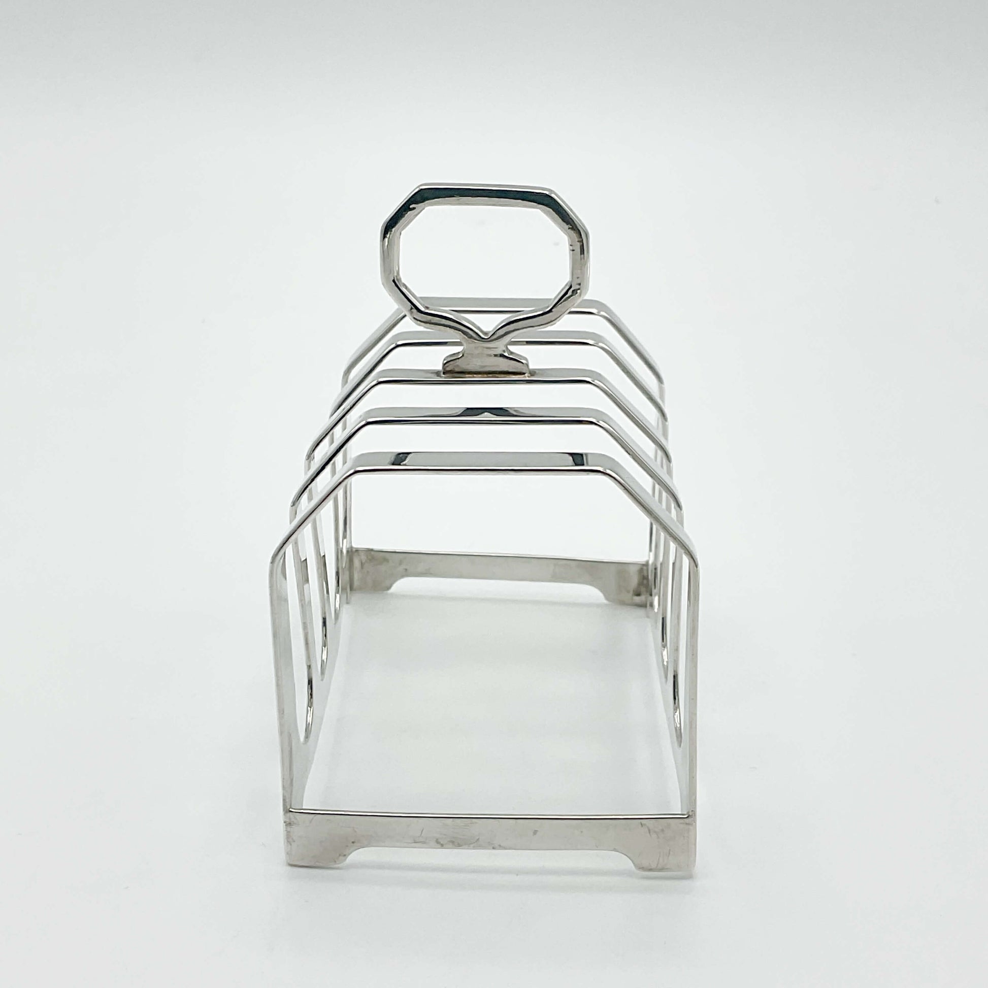 Art deco style Antique silver toast rack viewed from one end
