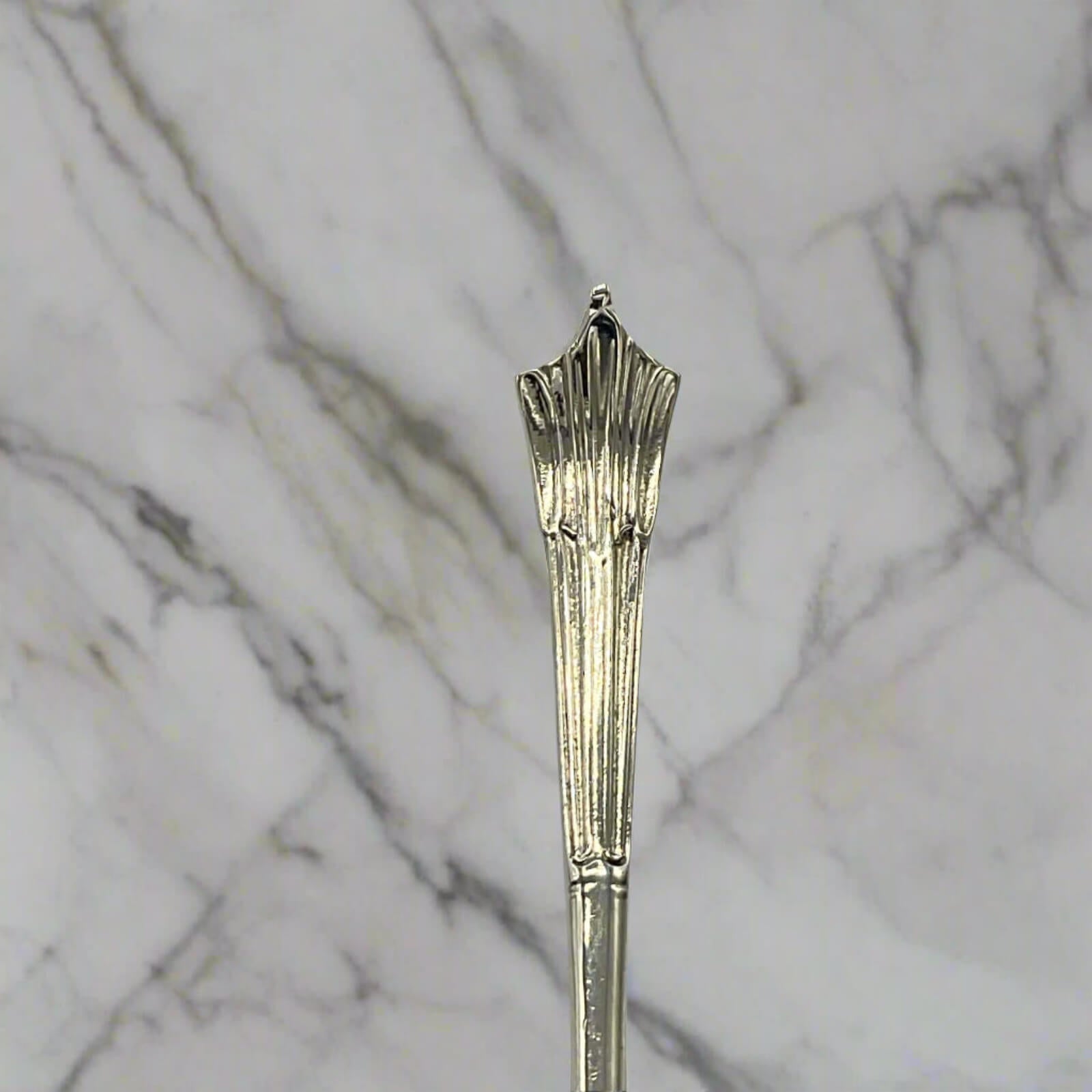 Decorative silver spoon on a marble background