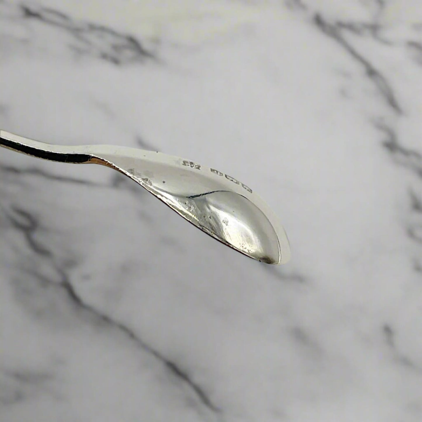 Silver spoon on a marble background