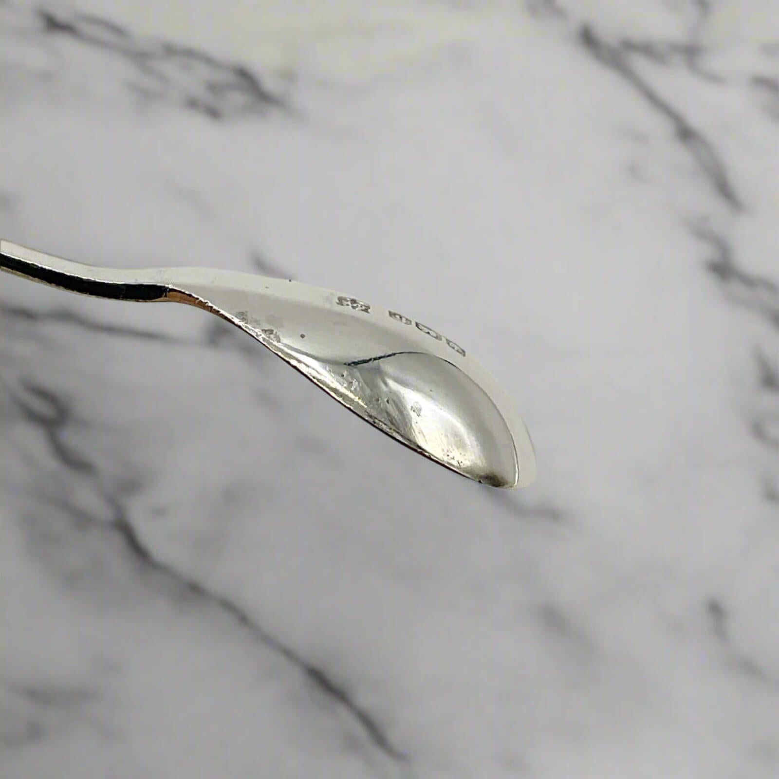 Silver spoon on a marble background