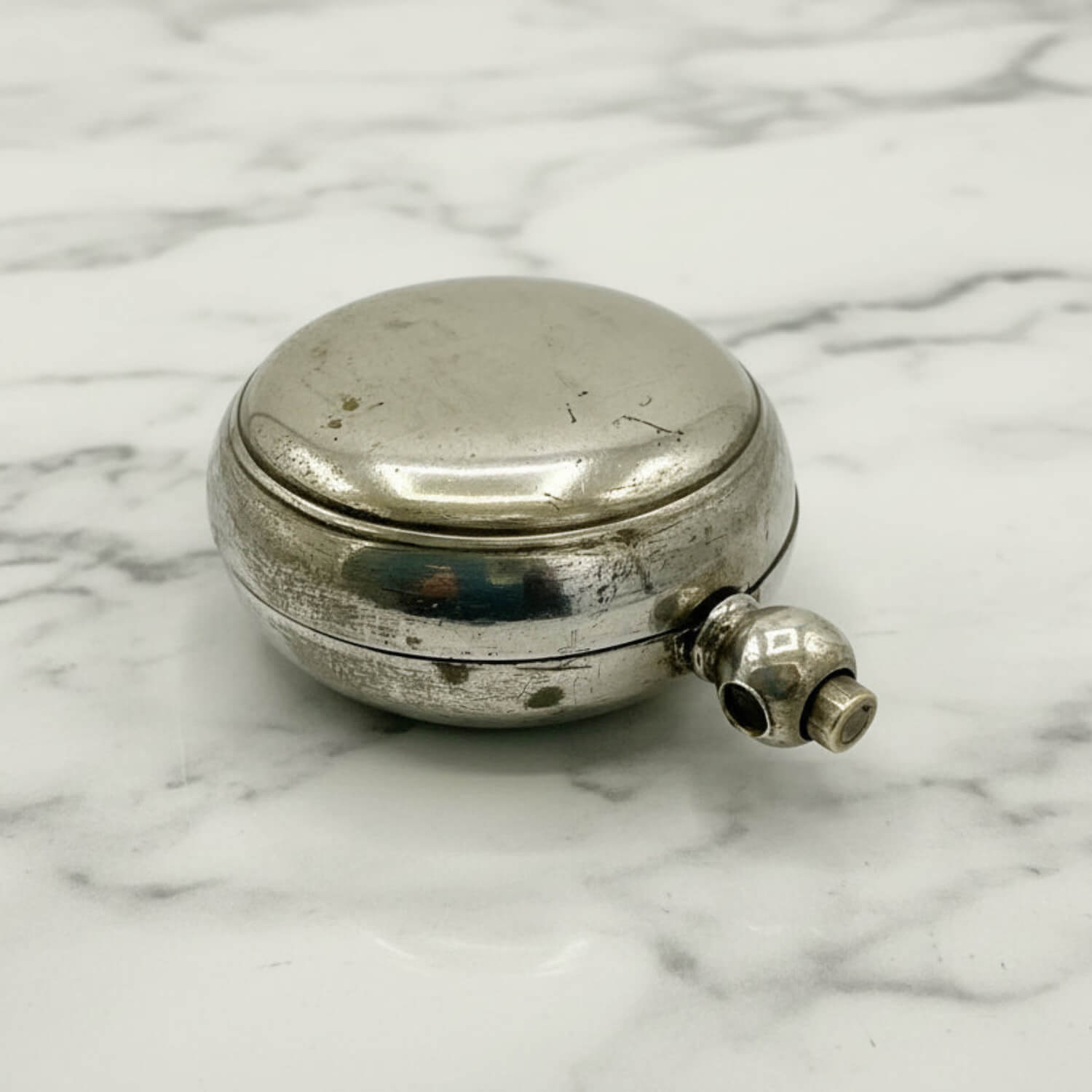 Antique Silver Plated Sovereign Case on  a marble worktop