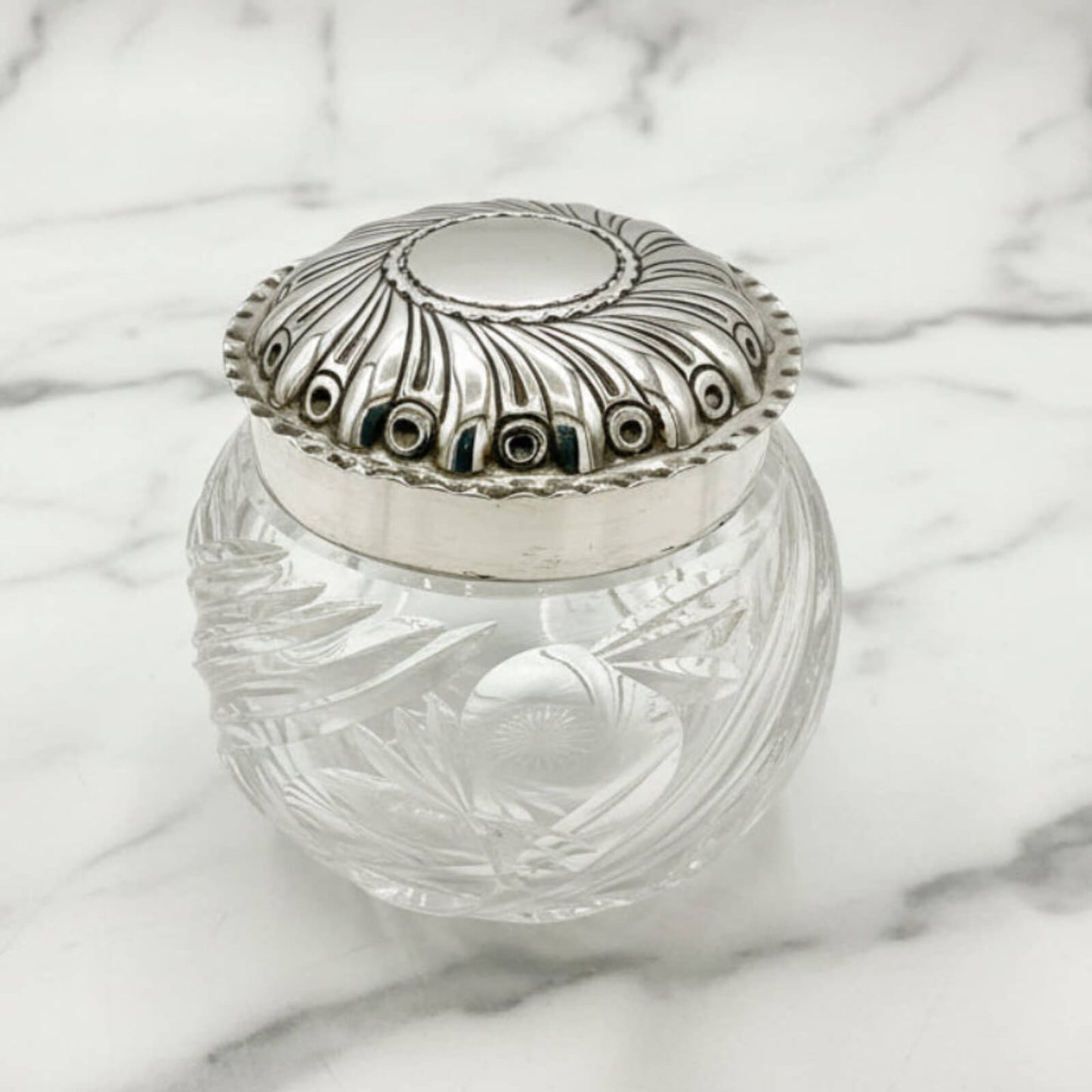 Antique Victorian Silver  and Glass Jar on a marble surface