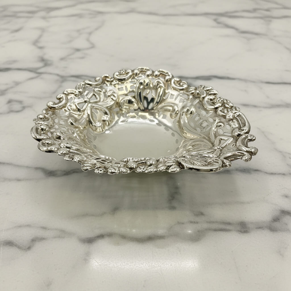 Antique Decorative silver bowl on a marble surface