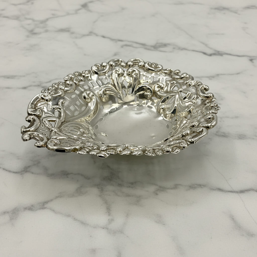 Decorative silver bowl on a marble surface