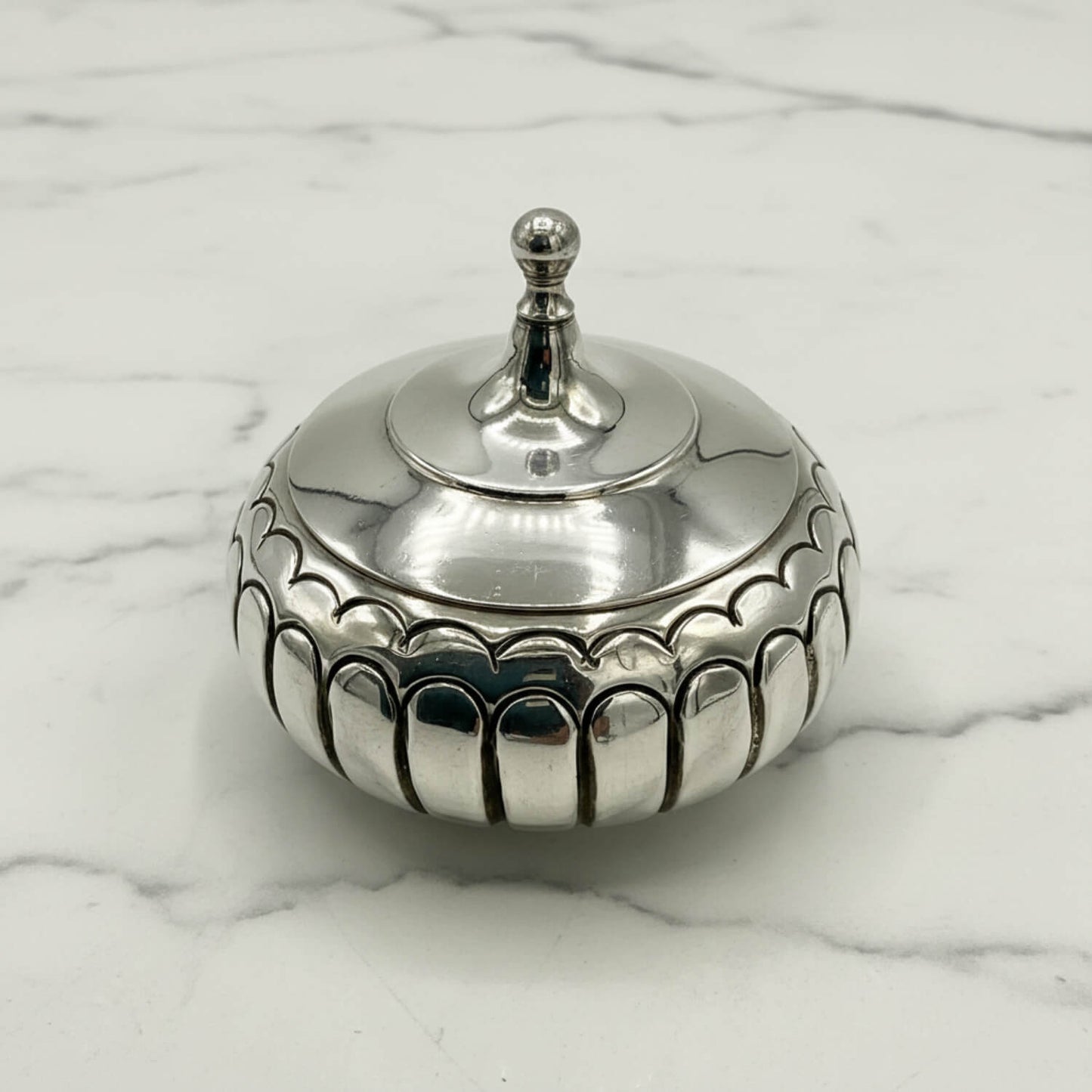 Antique Victorian Sterling Silver Box on a marble surface