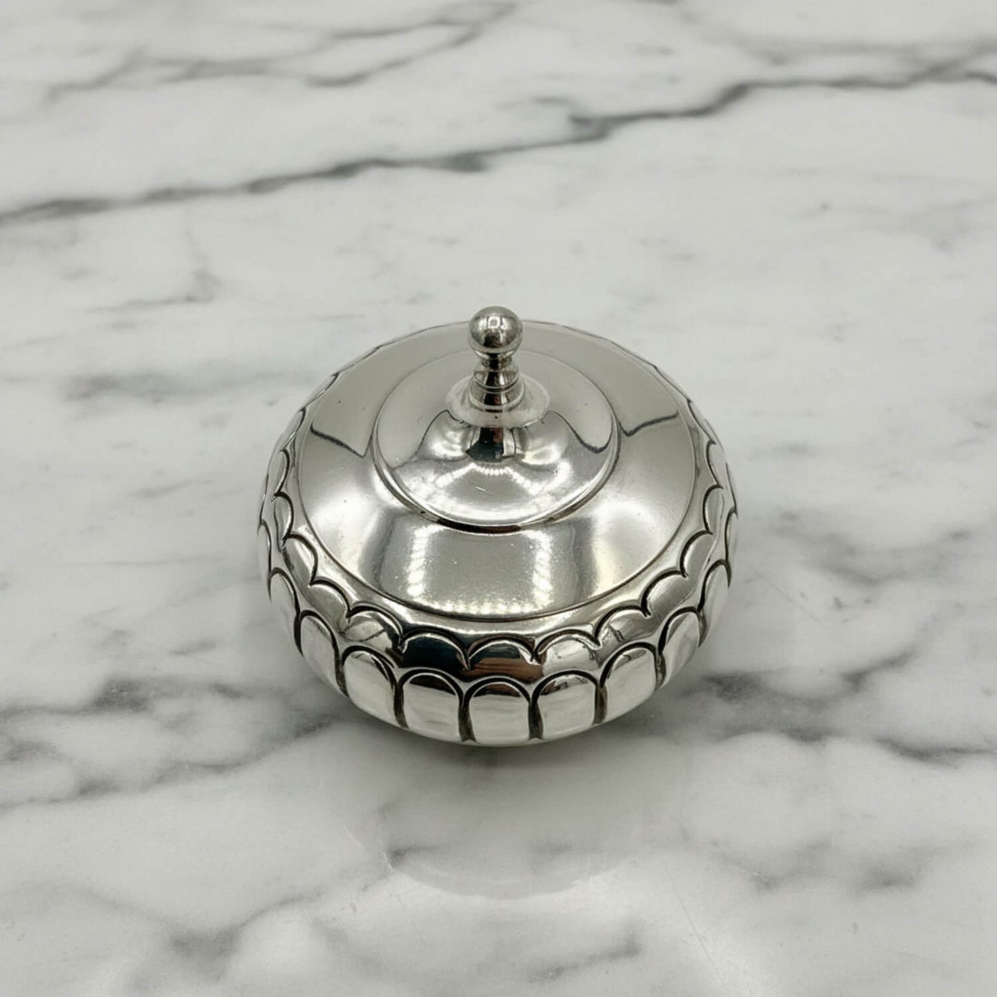 Antique Victorian Sterling Silver Box on a marble surface