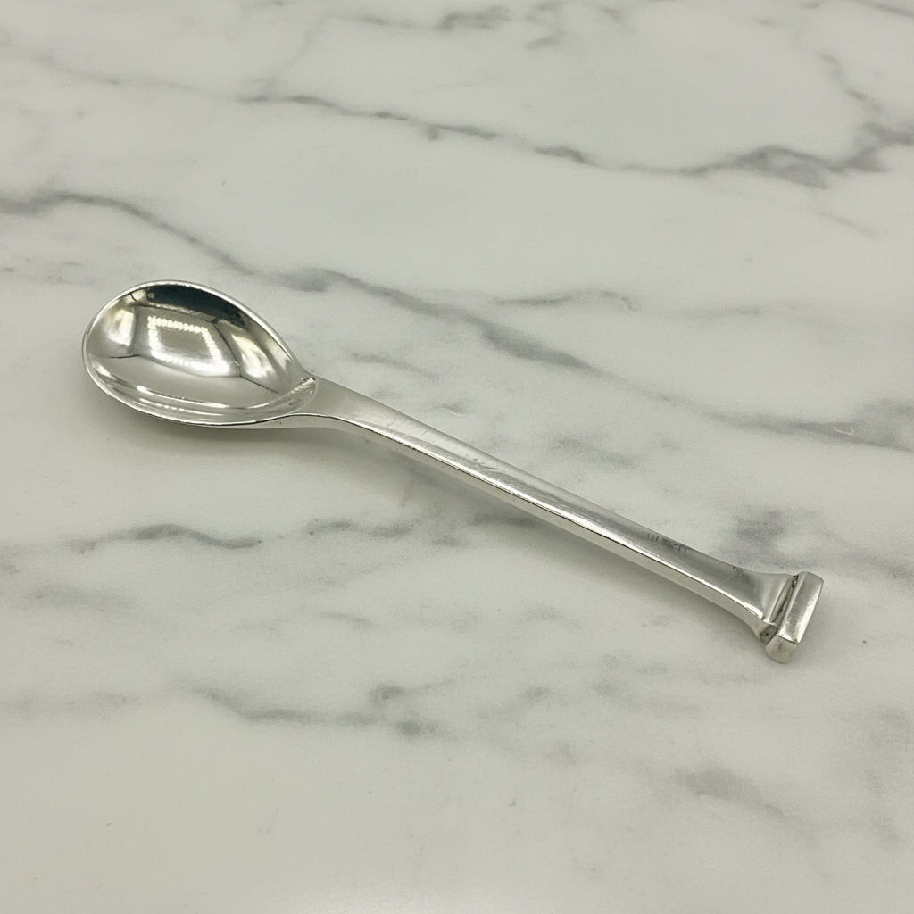 Silver spoon on a marble surface