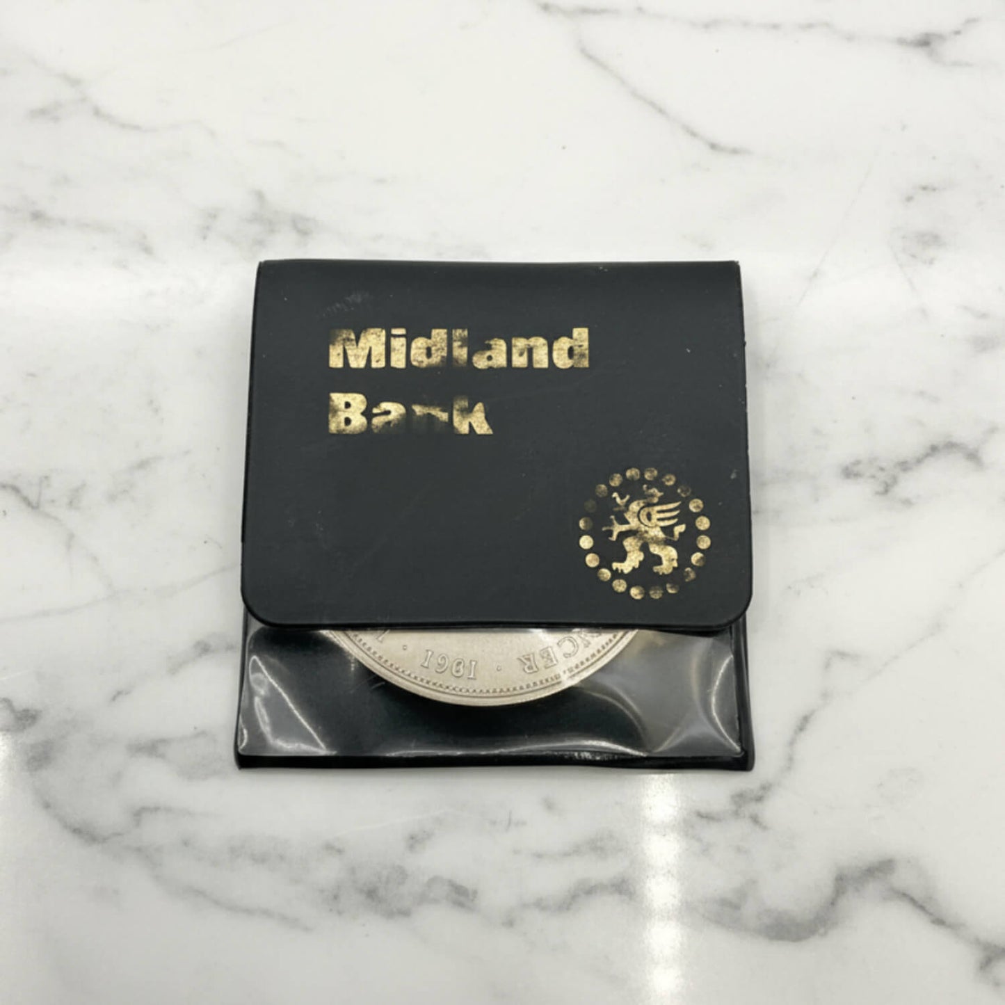 Charles and Diana 1981 Royal Wedding Coin on a marble surface